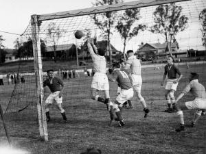 Leighton Buzzard comes close to scoring for Dudley Albion versus Halesowen Meteors. Trevor Bilston (not pictured) was busy refilling his pipe during this goalmouth scramble.